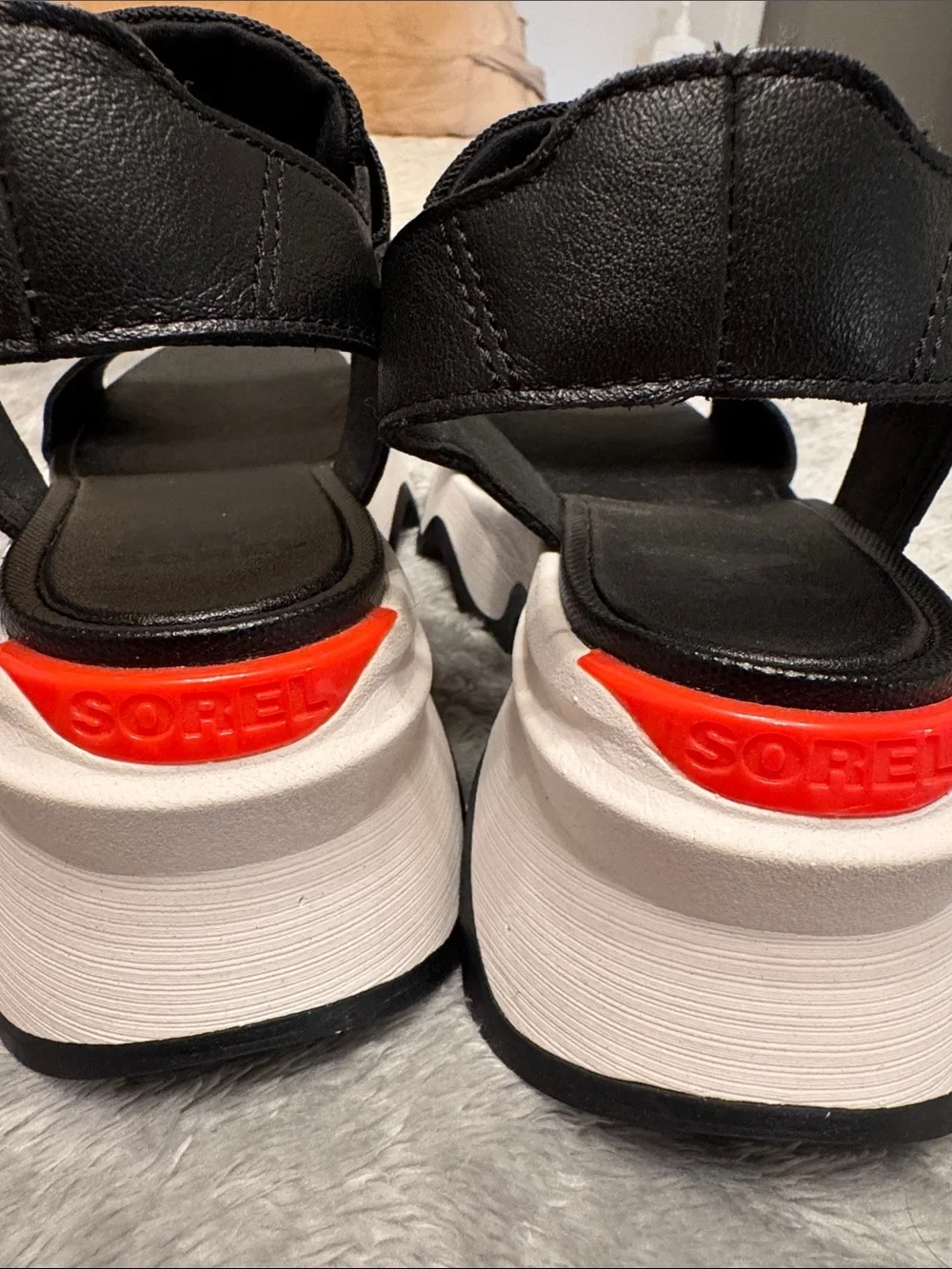 Sorel Black Platform Sandals with White Sole and Red Accent